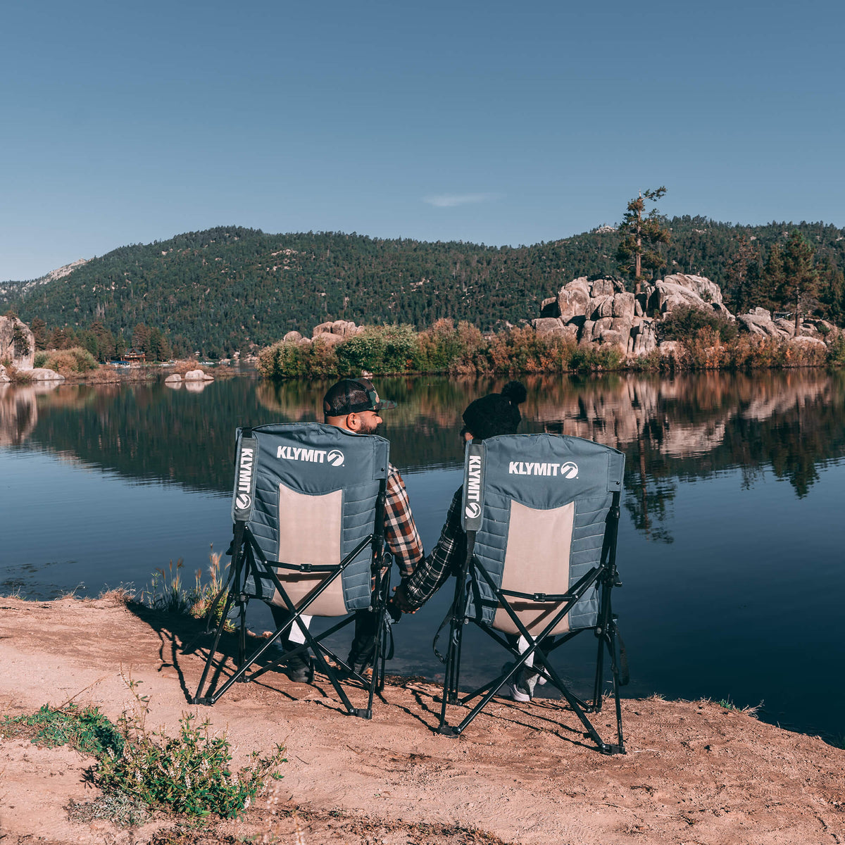 Two Klymit Switchback Camp Chairs by a lake